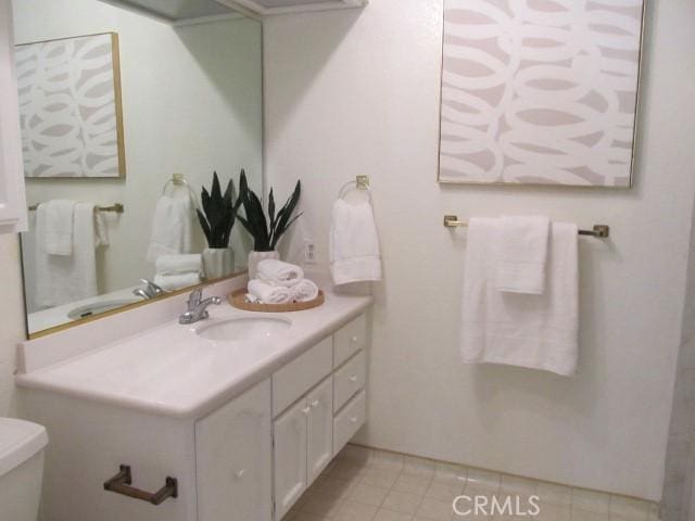 13601 Del Monte Dr Unit M17-46A, Seal Beach, CA 90740 - bathroom featuring toilet, vanity, and tile patterned flooring