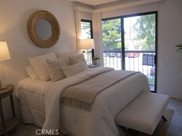 13601 Del Monte Dr Unit M17-46A, Seal Beach, CA 90740 - bedroom featuring access to exterior and carpet flooring