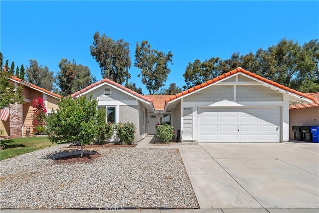 27747 Wakefield Rd, Castaic, CA 91384 - ranch-style home featuring a tile roof, a garage, concrete driveway, and stucco siding