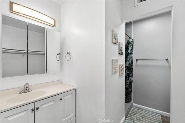 27747 Wakefield Rd, Castaic, CA 91384 - bathroom featuring vanity, curtained shower, and baseboards