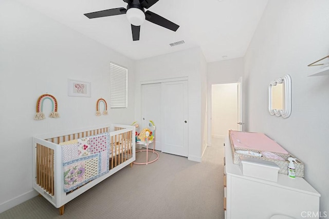 35806 Mccarthy St, Palm Desert, CA 92211 - carpeted bedroom featuring a crib, a closet, baseboards, and a ceiling fan