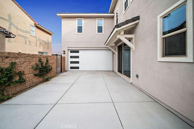 35806 Mccarthy St, Palm Desert, CA 92211 - view of front of home with stucco siding, driveway, and a garage