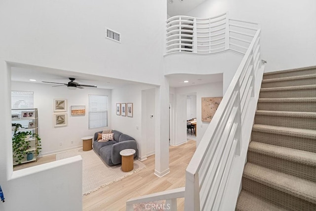 35806 Mccarthy St, Palm Desert, CA 92211 - stairs featuring wood finished floors, a ceiling fan, recessed lighting, and baseboards