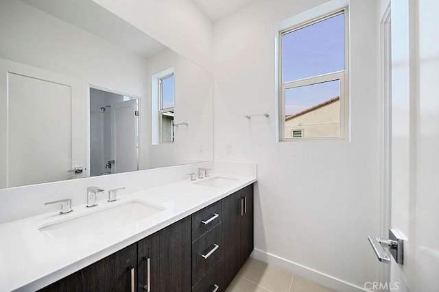 35806 Mccarthy St, Palm Desert, CA 92211 - bathroom with double vanity, baseboards, and tile patterned flooring