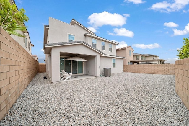 35806 Mccarthy St, Palm Desert, CA 92211 - rear view of property featuring central AC unit, stucco siding, a patio area, and a fenced backyard