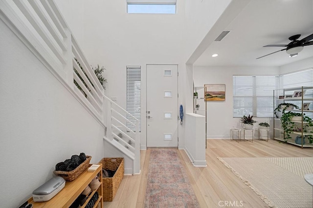 35806 Mccarthy St, Palm Desert, CA 92211 - foyer featuring light wood-style floors, stairs, plenty of natural light, a ceiling fan, and recessed lighting