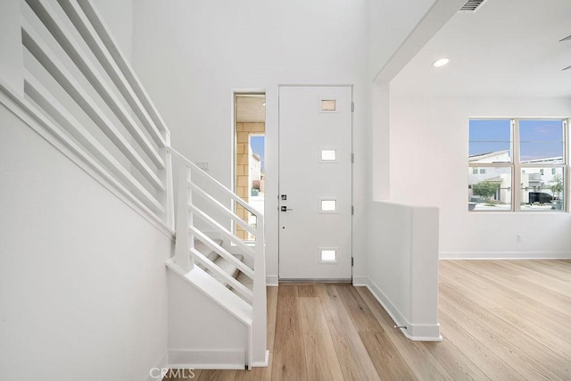 35806 Mccarthy St, Palm Desert, CA 92211 - foyer entrance with stairway, light wood-style floors, baseboards, and recessed lighting