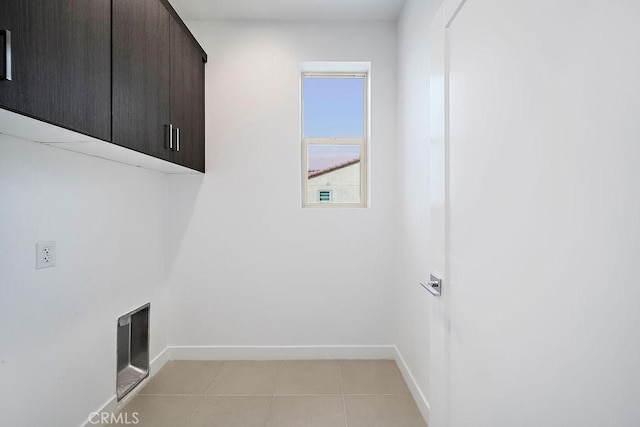 35806 Mccarthy St, Palm Desert, CA 92211 - laundry area featuring cabinet space, baseboards, and light tile patterned flooring