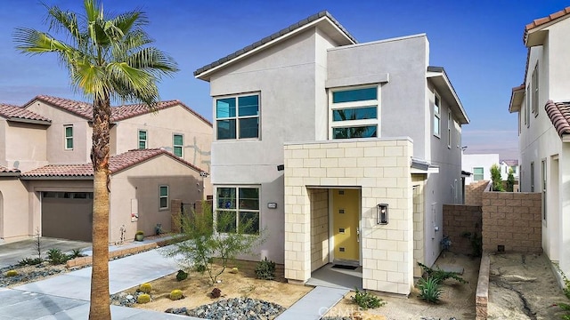 35806 Mccarthy St, Palm Desert, CA 92211 - view of front facade with stucco siding, an attached garage, and concrete driveway