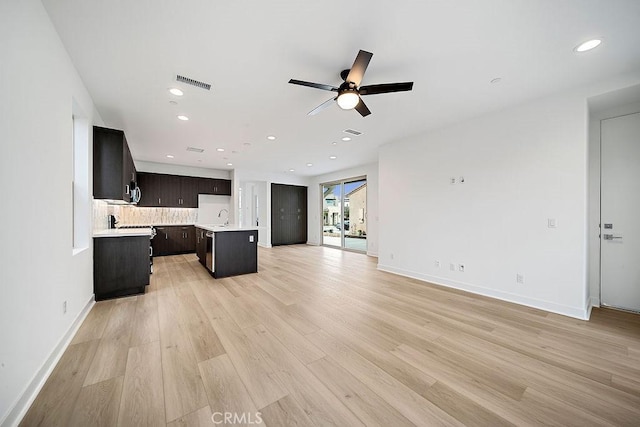 35806 Mccarthy St, Palm Desert, CA 92211 - unfurnished living room with a ceiling fan, light wood finished floors, recessed lighting, a sink, and baseboards