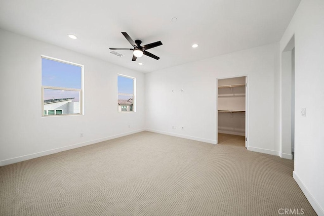 35806 Mccarthy St, Palm Desert, CA 92211 - unfurnished bedroom featuring light carpet, recessed lighting, baseboards, ceiling fan, and a walk in closet