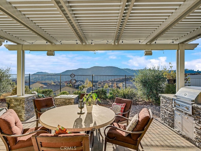 374 Ventasso Way, Fallbrook, CA 92028 - view of patio / terrace with outdoor dining space, a mountain view, and a pergola