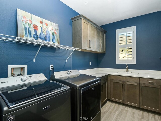374 Ventasso Way, Fallbrook, CA 92028 - washroom featuring washer and dryer, cabinet space, and light wood finished floors