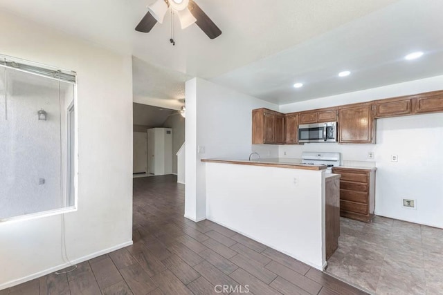 37940 42nd St E Unit 125, Palmdale, CA 93552 - kitchen featuring ceiling fan, stainless steel microwave, white range, a peninsula, and dark wood-style floors