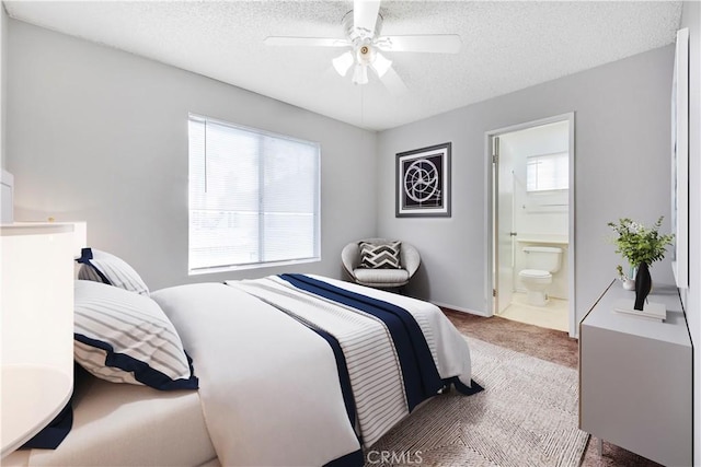 37940 42nd St E Unit 125, Palmdale, CA 93552 - bedroom featuring carpet, a textured ceiling, connected bathroom, a ceiling fan, and baseboards