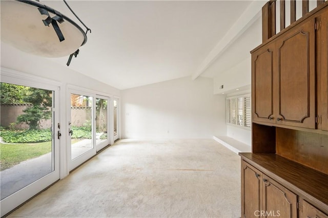 390 Peralta Ave, Long Beach, CA 90803 - unfurnished living room with lofted ceiling and light colored carpet