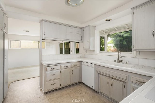 390 Peralta Ave, Long Beach, CA 90803 - kitchen featuring white dishwasher, a sink, and tile counters