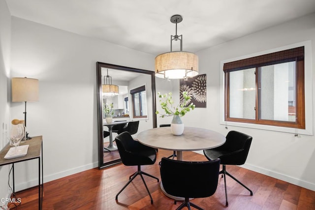 1000 E California Blvd Unit 108, Pasadena, CA 91106 - dining room featuring baseboards and wood finished floors