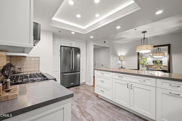 1000 E California Blvd Unit 108, Pasadena, CA 91106 - kitchen with high end fridge, recessed lighting, decorative backsplash, and white cabinets