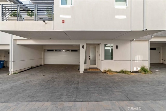 2713 Carnegie Ln Unit B, Redondo Beach, CA 90278 - view of front of house featuring a garage and stucco siding