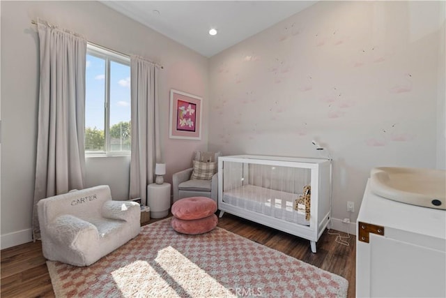 2713 Carnegie Ln Unit B, Redondo Beach, CA 90278 - bedroom with baseboards, wood finished floors, a crib, and recessed lighting