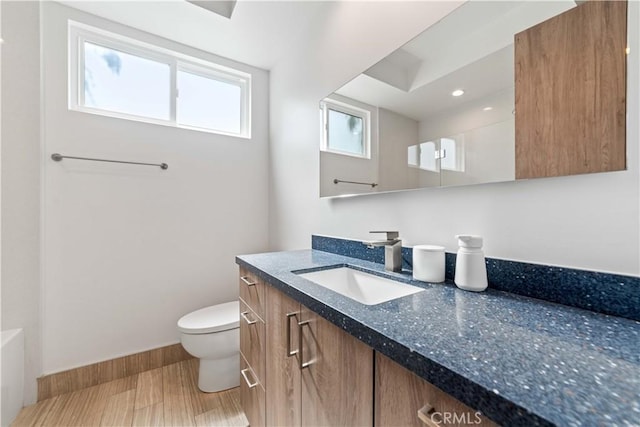 2713 Carnegie Ln Unit B, Redondo Beach, CA 90278 - bathroom with vanity, toilet, wood finished floors, and baseboards