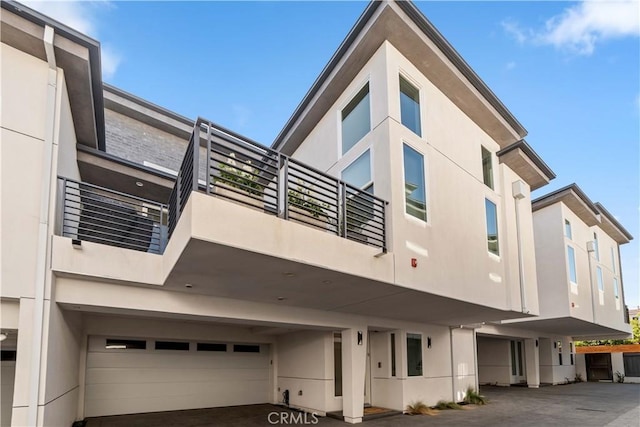 2713 Carnegie Ln Unit B, Redondo Beach, CA 90278 - view of building exterior with a garage