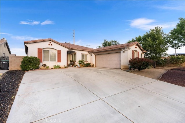 39202 Nicole Dr, Palmdale, CA 93551 - mediterranean / spanish-style home featuring a tiled roof, an attached garage, stucco siding, and driveway