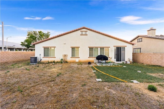 39202 Nicole Dr, Palmdale, CA 93551 - back of property featuring stucco siding and central AC unit