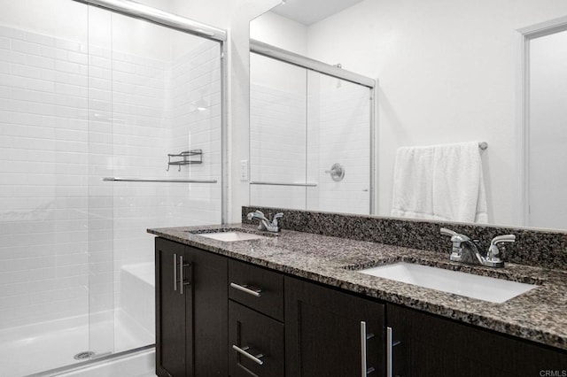 5485 Seacliff Pl Unit 106, San Diego, CA 92154 - bathroom with a stall shower and double vanity