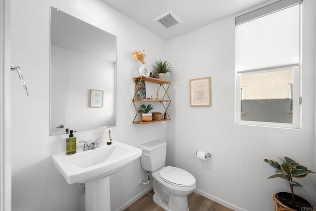 5485 Seacliff Pl Unit 106, San Diego, CA 92154 - bathroom featuring wood finished floors, toilet, and baseboards