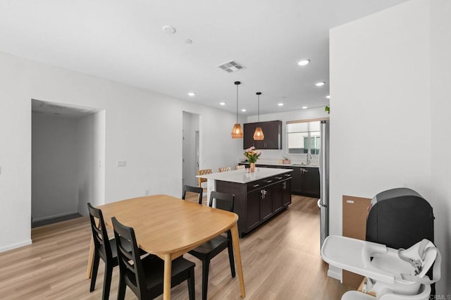 5485 Seacliff Pl Unit 106, San Diego, CA 92154 - dining area featuring light wood-type flooring and recessed lighting
