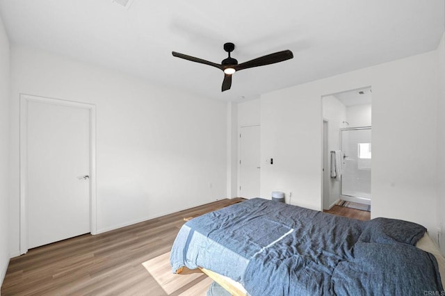 5485 Seacliff Pl Unit 106, San Diego, CA 92154 - bedroom with wood finished floors, ensuite bath, and a ceiling fan