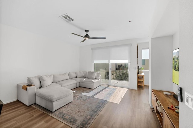 5485 Seacliff Pl Unit 106, San Diego, CA 92154 - living room featuring wood finished floors and ceiling fan