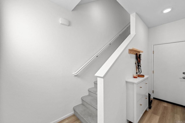 5485 Seacliff Pl Unit 106, San Diego, CA 92154 - staircase with wood finished floors, baseboards, and recessed lighting