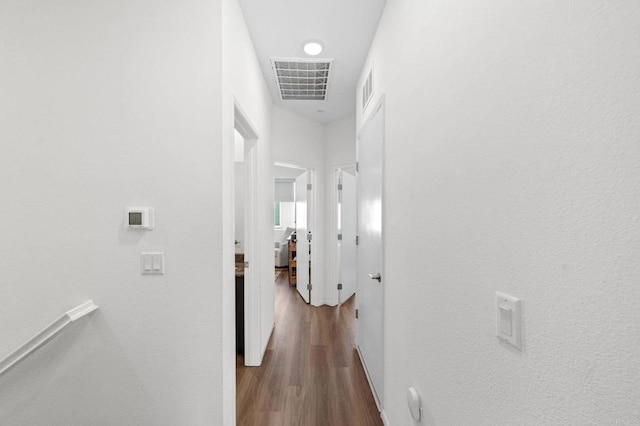 5485 Seacliff Pl Unit 106, San Diego, CA 92154 - corridor with dark wood-style floors and baseboards