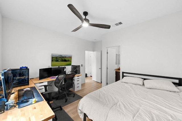 5485 Seacliff Pl Unit 106, San Diego, CA 92154 - bedroom with an office area, wood finished floors, and a ceiling fan