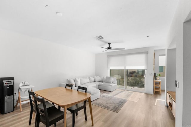 5485 Seacliff Pl Unit 106, San Diego, CA 92154 - dining room featuring a ceiling fan and light wood-style floors