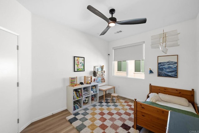 5485 Seacliff Pl Unit 106, San Diego, CA 92154 - bedroom with wood finished floors, baseboards, and a ceiling fan