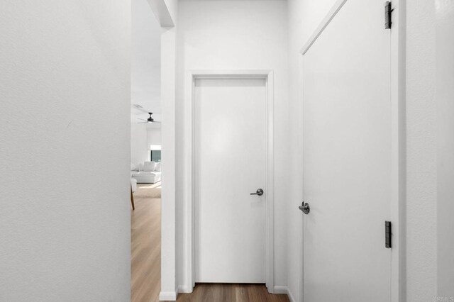 5485 Seacliff Pl Unit 106, San Diego, CA 92154 - hallway with wood finished floors