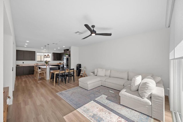 5485 Seacliff Pl Unit 106, San Diego, CA 92154 - living room featuring light wood finished floors, a ceiling fan, and recessed lighting
