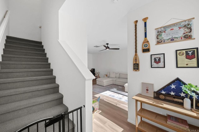 5485 Seacliff Pl Unit 106, San Diego, CA 92154 - staircase with wood finished floors and ceiling fan