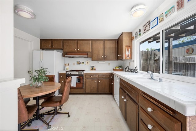 4418 Larwin Ave, Cypress, CA 90630 - kitchen with white appliances, light flooring, and a sink