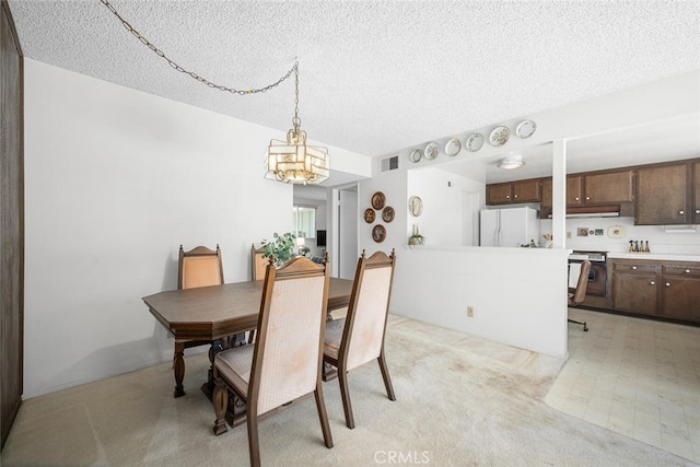 4418 Larwin Ave, Cypress, CA 90630 - dining room featuring a textured ceiling and a chandelier