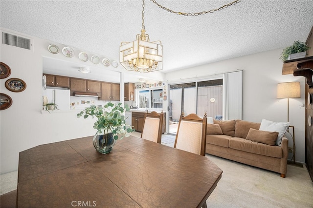 4418 Larwin Ave, Cypress, CA 90630 - dining space with a chandelier, light colored carpet, and a textured ceiling