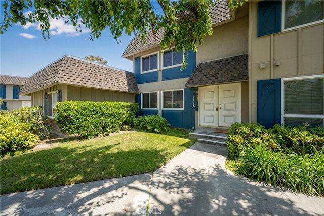 4418 Larwin Ave, Cypress, CA 90630 - view of front of home with a front lawn and stucco siding