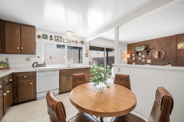 4418 Larwin Ave, Cypress, CA 90630 - kitchen featuring dishwasher, dark brown cabinets, tile counters, and light floors