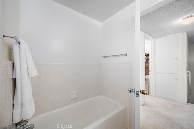 4418 Larwin Ave, Cypress, CA 90630 - bathroom featuring a tub and a textured ceiling