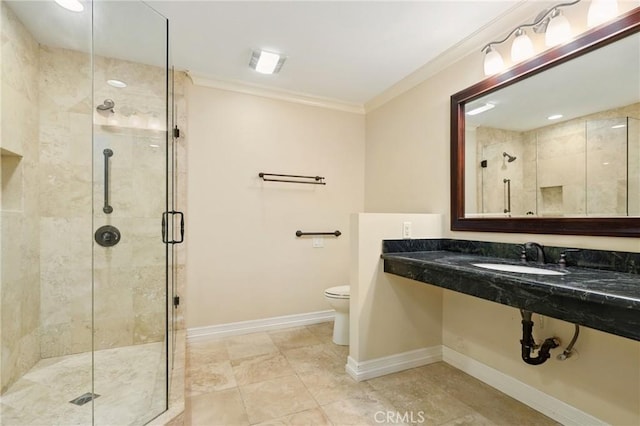 3413 Punta Alta Unit A, Laguna Woods, CA 92637 - bathroom with a sink, crown molding, toilet, a shower stall, and baseboards