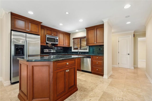 3413 Punta Alta Unit A, Laguna Woods, CA 92637 - kitchen featuring stainless steel appliances, decorative backsplash, a center island, crown molding, and a sink